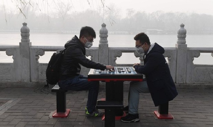 China smog: millions start new year shrouded by health alerts and travel chaos 